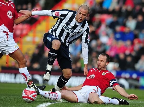 Bristol City's Louis Carey Tackles West Bromwich Albion's Roman Bednal - Football Championship Clash, 2010