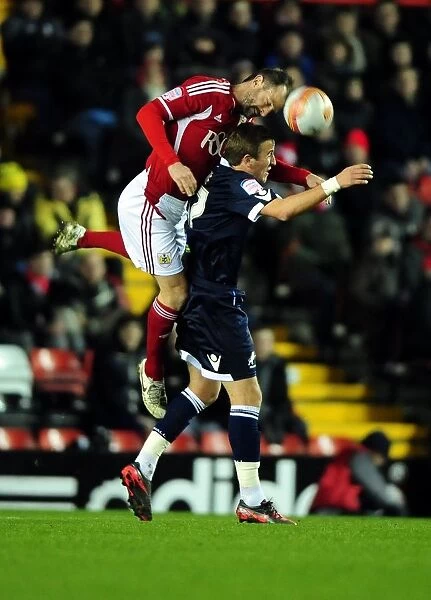 Bristol City's Louis Carey vs. Harry Kane: A Battle for the High Ball in the 2012 Championship Match between Bristol City and Millwall