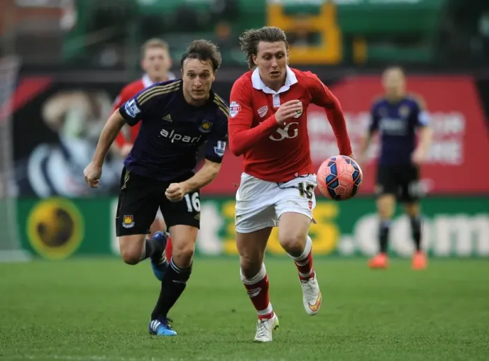 Framed Print : Bristol City's Luke Freeman Chased Down by Mark Noble during FA Cup Fourth Round Clash vs West Ham United Framed Print : Bristol City's Luke Freeman Chased Down by Mark Noble during FA Cup Fourth Round Clash vs West Ham United