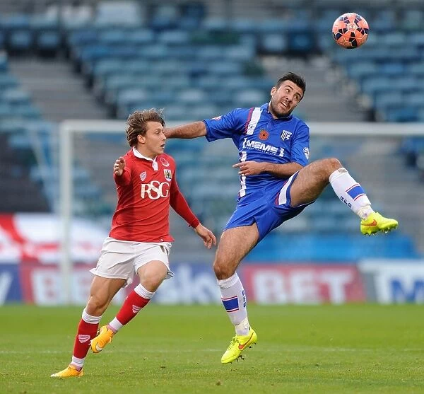 Bristol City's Luke Freeman Closes In on Gillingham's Michael Doughty during FA Cup Clash