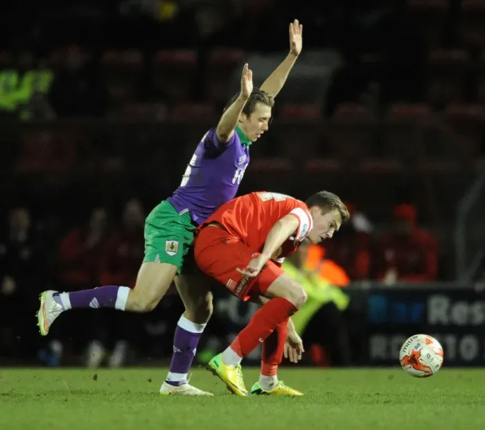 Framed Print : Bristol City's Luke Freeman Closes In on Leyton Orient's Ryan Hedges in Sky Bet League One Showdown