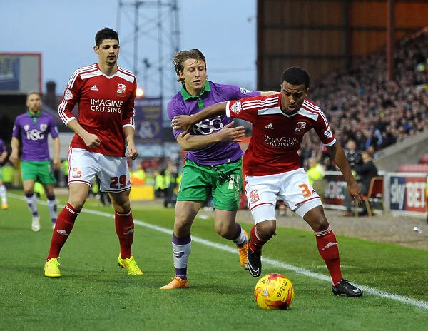 Bristol City's Luke Freeman Closes In on Swindon Town's Nathan Byrne during Sky Bet League One Match
