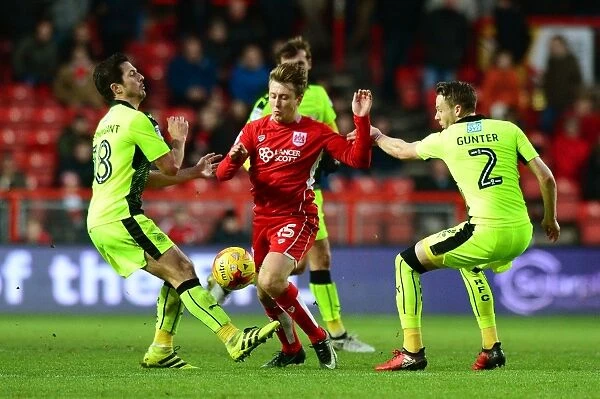 Bristol City's Luke Freeman Dodges Defenders Chris Gunter and Yann Kermorgant During the Sky Bet Championship Match Against Reading