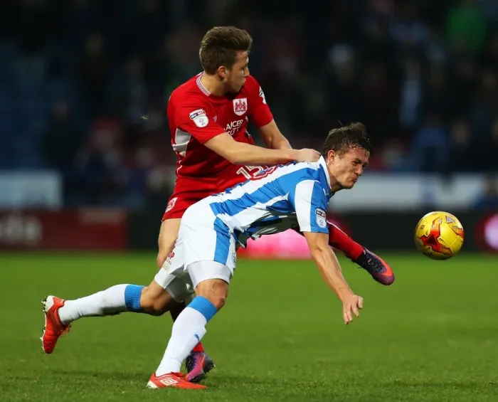 Framed Print : Bristol City's Luke Freeman Faces Off Against Huddersfield Town's Jonathan Hogg in Championship Clash
