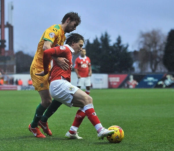 Bristol City's Luke Freeman Fends Off Sam Foley's Pressure During Sky Bet League One Clash