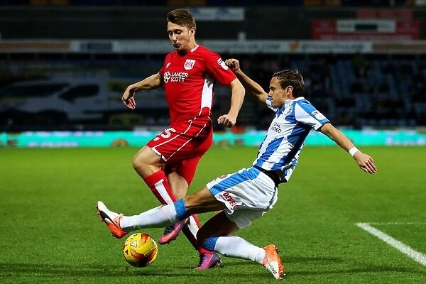 Bristol City's Luke Freeman Tackled by Huddersfield Town Player during Sky Bet Championship Match