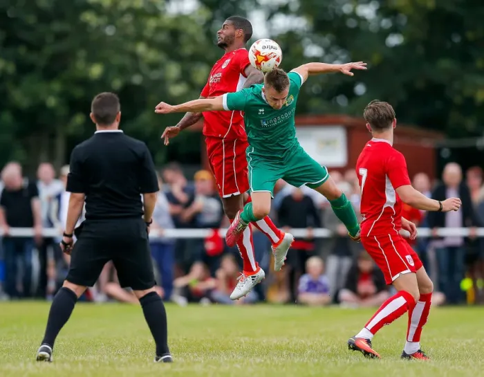 Framed Print : Bristol City's Mark Little Battles in the Air during Pre-Season Community Match against Hengrove Athletic Framed Print : Bristol City's Mark Little Battles in the Air during Pre-Season Community Match against Hengrove Athletic