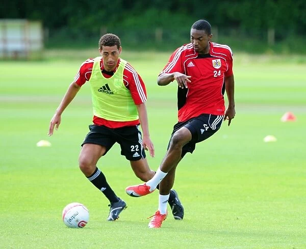 Bristol Citys Marlon Jackson battles for the ball with Bristol Citys Lewin Nyatanga