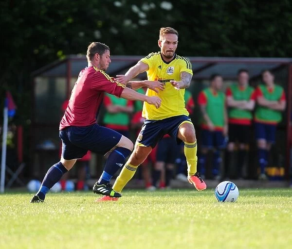 Bristol City's Martin Woods Faces Off Against Ashton and Backwell United Opponent in Pre-Season Friendly