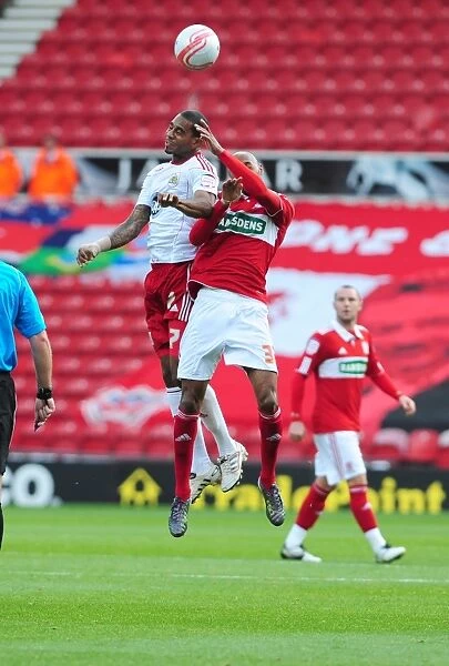 Bristol Citys Marvin Elliott battles for the ball in the air with Middlesbroughs Mickael Tavares