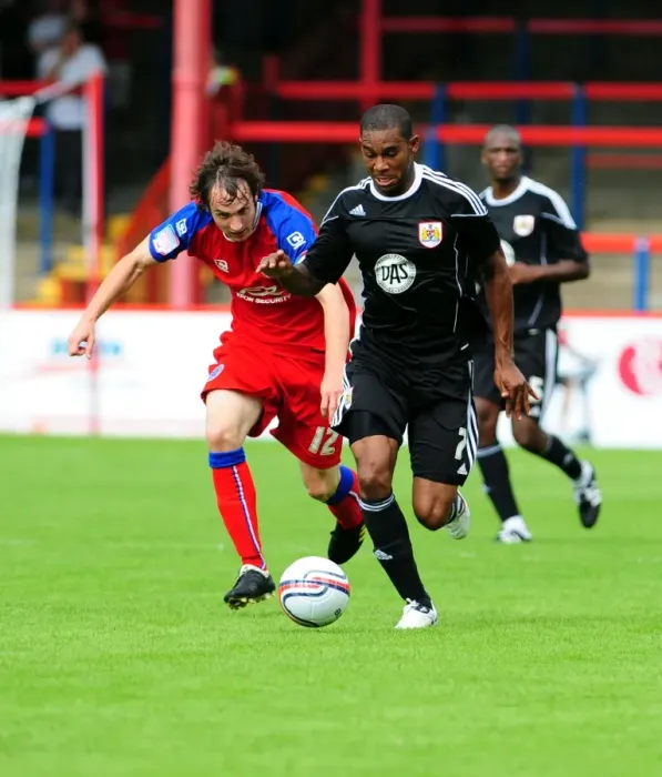 Framed Print : Bristol Citys Marvin Elliott battles for the ball with Aldershots Danny Hylton Framed Print : Bristol Citys Marvin Elliott battles for the ball with Aldershots Danny Hylton