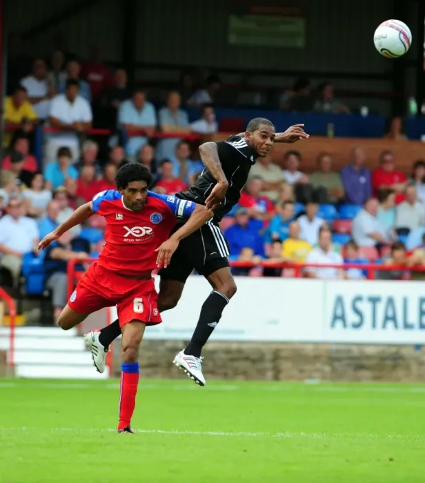 Framed Print : Bristol Citys Marvin Elliott challenges for the ariel ball with Aldershots Anthony Charles Framed Print : Bristol Citys Marvin Elliott challenges for the ariel ball with Aldershots Anthony Charles