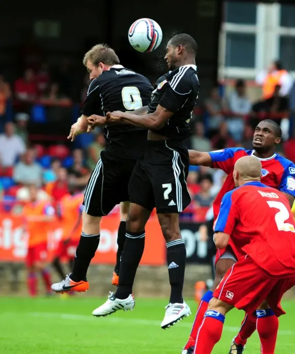 Framed Print : Bristol City's Marvin Elliott and David Clarkson Contest for Aerial Ball in Action- Packed Aldershot Match