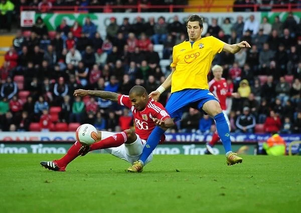 Bristol City's Marvin Elliott Fouled by Morgan Schneiderlin in Championship Match against Southampton (November 26, 2011)