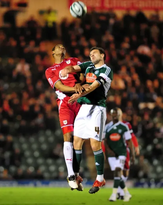 Framed Print : Bristol City's Marvin Elliott vs. Plymouth Argyle's Carl Fletcher: Aerial Battle in Championship Match, March 2010 Framed Print : Bristol City's Marvin Elliott vs. Plymouth Argyle's Carl Fletcher: Aerial Battle in Championship Match, March 2010