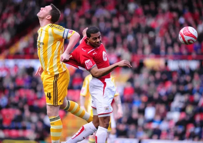 Framed Print : Bristol City's Marvin Elliott vs. Newcastle United's Kevin Nolan: Aerial Battle in the Championship (20 / 03 / 2010)