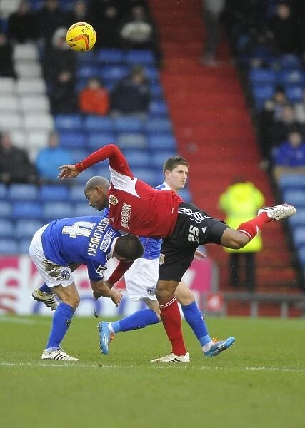 Bristol City's Marvin Elliott vs Oldham Athletic's James Wesolowski: Battle for the Ball in Oldham Athletic v Bristol City (Oldham v BCFC), Sky Bet League One