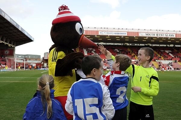 Bristol City's Mascot Scrumpy Engages with Young Fans during Bristol City v Gillingham Match, March 2014