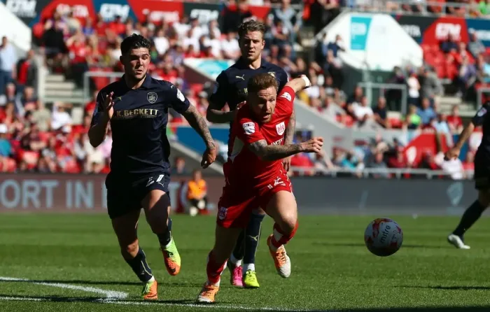 Framed Print : Bristol City's Matt Taylor Evades Barnsley's Alex Mowatt during Sky Bet Championship Clash Framed Print : Bristol City's Matt Taylor Evades Barnsley's Alex Mowatt during Sky Bet Championship Clash
