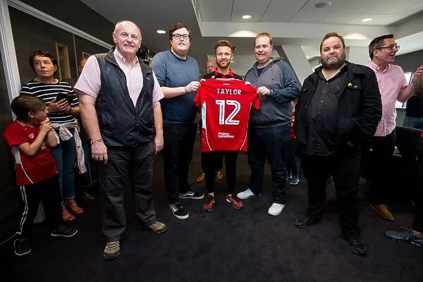 Bristol City's Matt Taylor Presents Sponsors with Signed Shirt after Championship Match against Birmingham City