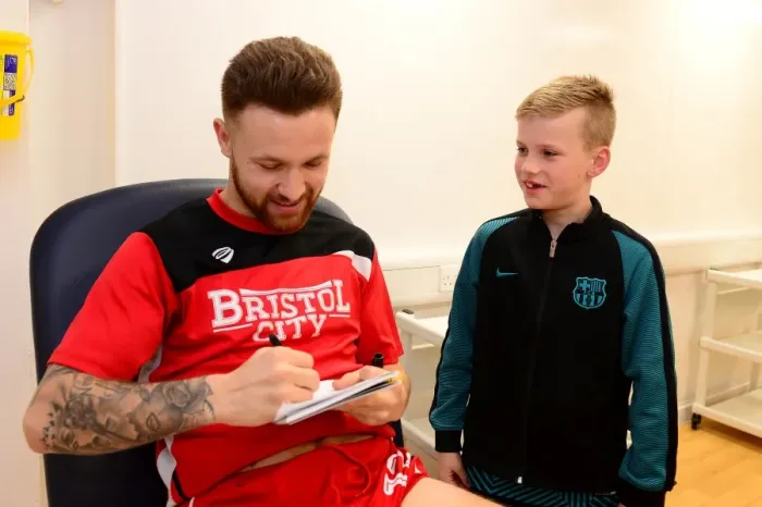 Framed Print : Bristol City's Matty Taylor Greets Mascot Before Fulham Clash Framed Print : Bristol City's Matty Taylor Greets Mascot Before Fulham Clash