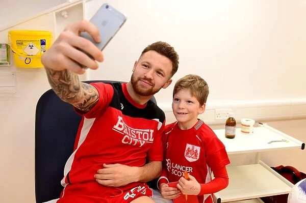 Bristol City's Matty Taylor Meets the Mascot Before Facing Fulham in 2017 Championship Match