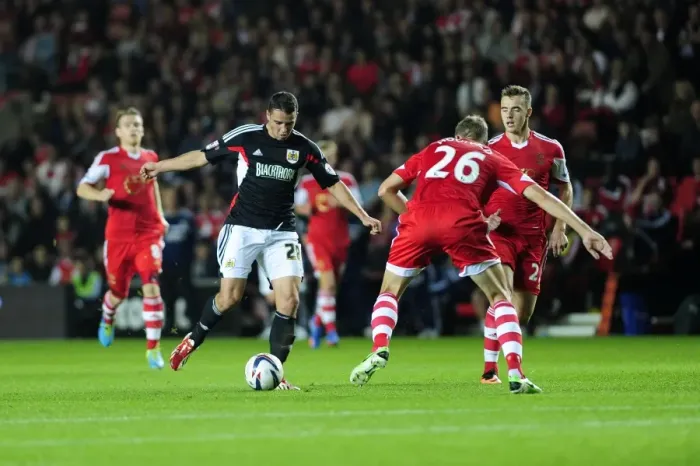 Framed Print : Bristol City's McLaughlin Charges Past Hooiveld in Southampton Showdown Framed Print : Bristol City's McLaughlin Charges Past Hooiveld in Southampton Showdown