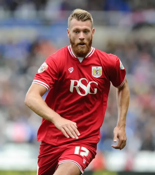 Framed Print : Bristol City's Nathan Baker Faces Off Against Birmingham City in Championship Clash Framed Print : Bristol City's Nathan Baker Faces Off Against Birmingham City in Championship Clash