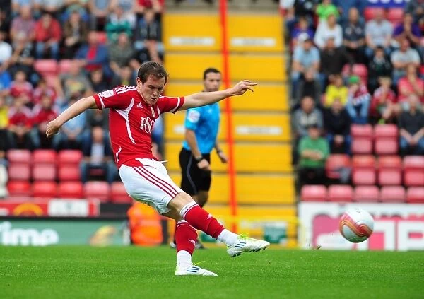 Bristol City's Neil Kilkenny Shoots from Distance in Championship Match against Brighton (10-09-2011)