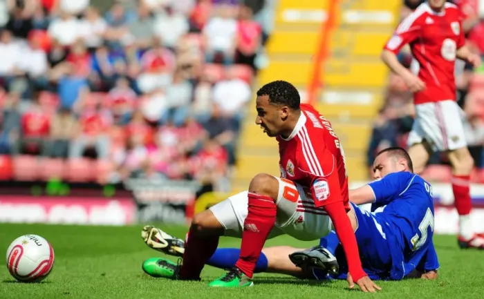 Framed Print : Bristol City's Nicky Maynard Foul by Ipswich's Damien Delaney in Championship Match, April 2011