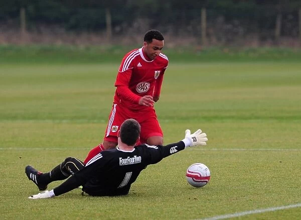 Bristol Citys Nicky Maynard rounds the Swindon Keeper but sees his shot cleared of the line