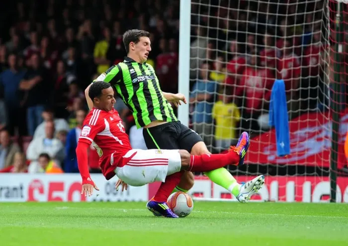 Framed Print : Bristol City's Nicky Maynard Thwarts by Brighton's Lewis Dunk in Championship Clash - 10 / 09 / 2011