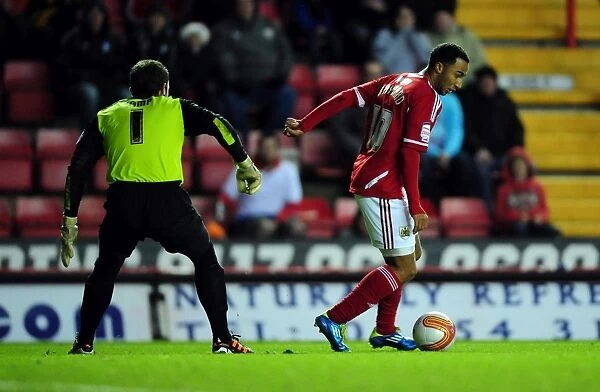 Bristol City's Nicky Maynard Tries to Outmaneuver Nottingham Forest's Lee Camp in Championship Match, 17 / 12 / 2011