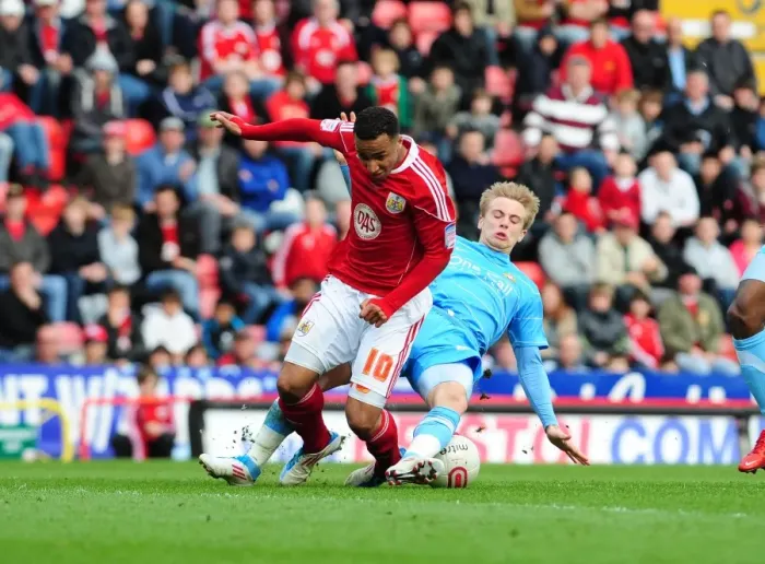 Framed Print : Bristol City's Nicky Maynard vs. Joseph Mills Tackle: Championship Clash Between Bristol City and Doncaster Rovers (02 / 04 / 2011)