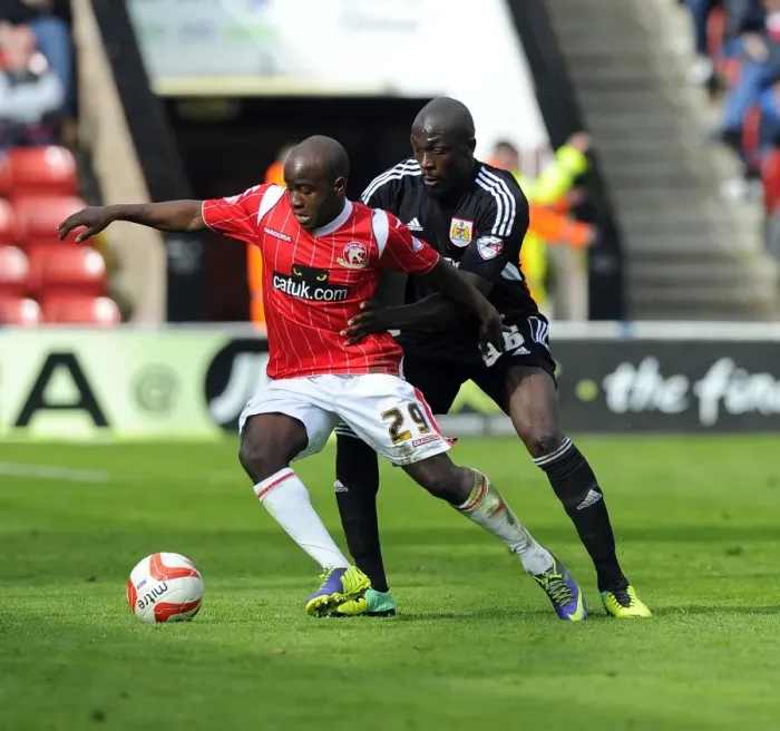 Framed Print : Bristol City's Nyron Nosworthy vs. Walsall's Febian Brandy: A Battle for the Ball
