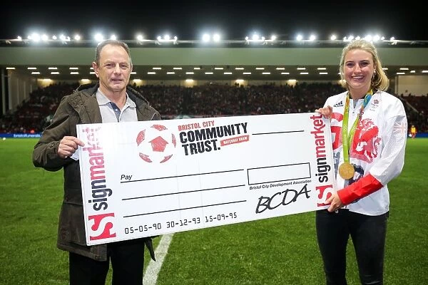 Bristol City's Olympic Hero Lily Owsley Presents Half Time Draw Cheque at Ashton Gate Stadium