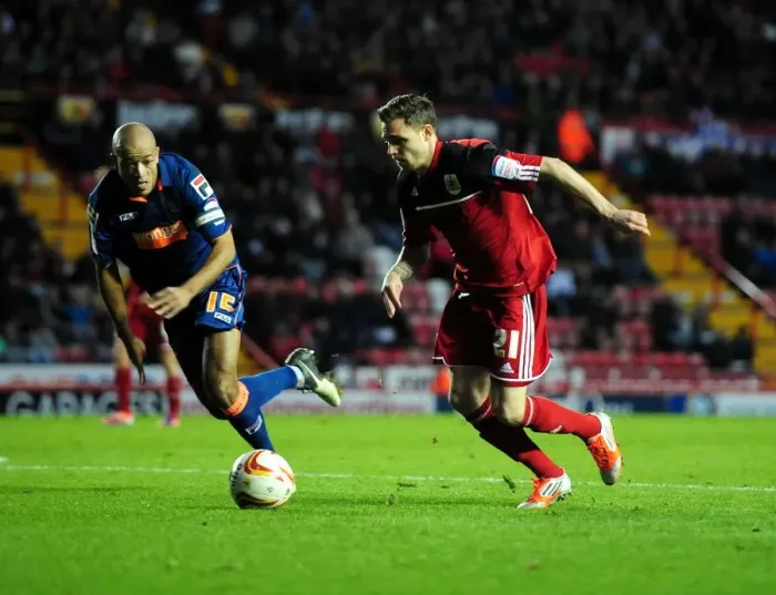 Framed Print : Bristol City's Paul Anderson Outmaneuvers Blackpool's Alex John-Baptiste in Championship Clash