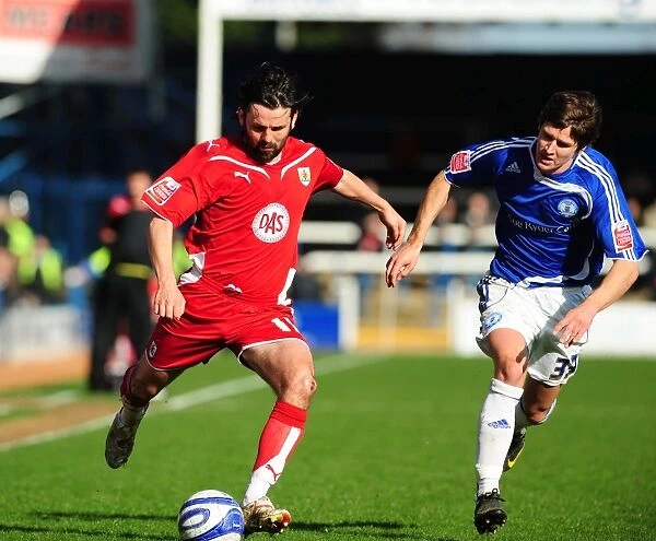 Bristol City's Paul Hartley vs. Peterborough's Josh Simpson: A Championship Battle, March 2010