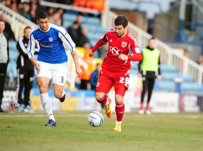 Framed Print : Bristol City's Richard Foster Outmaneuvers Peterborough's Matthew Briggs During the 2012 Match