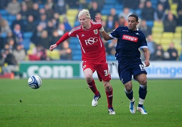 Bristol City's Ryan McGivern vs. Liam Feeney: Battle for the Ball in Millwall vs. Bristol City Championship Match, 2011