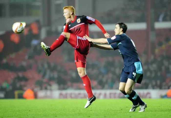 Framed Print : Bristol City's Ryan Taylor Outmuscles Burnley's Michael Duff for the Ball in Championship Clash at Ashton Gate Framed Print : Bristol City's Ryan Taylor Outmuscles Burnley's Michael Duff for the Ball in Championship Clash at Ashton Gate