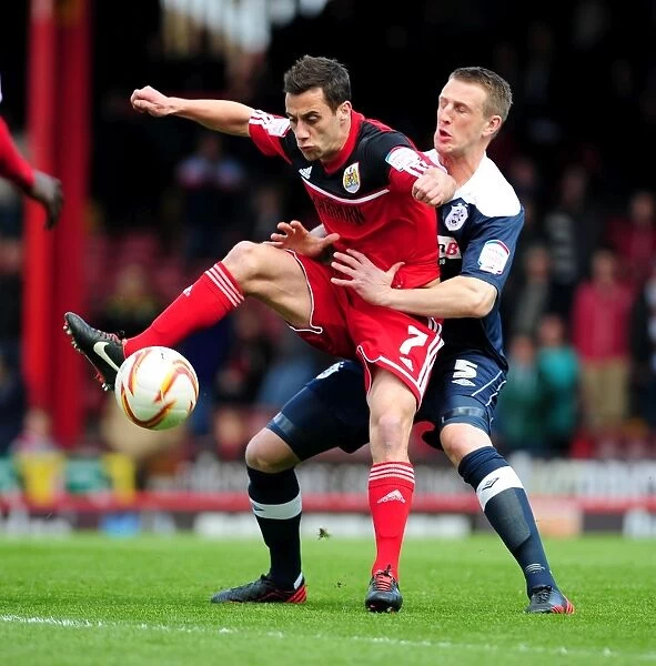 Bristol City's Sam Baldock Battles for Ball Possession Against Huddersfield Town's Peter Clarke