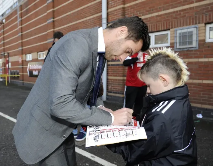 Framed Print : Bristol City's Sam Baldock Brings Smiles to a Young Fan with Autographed Programme Framed Print : Bristol City's Sam Baldock Brings Smiles to a Young Fan with Autographed Programme