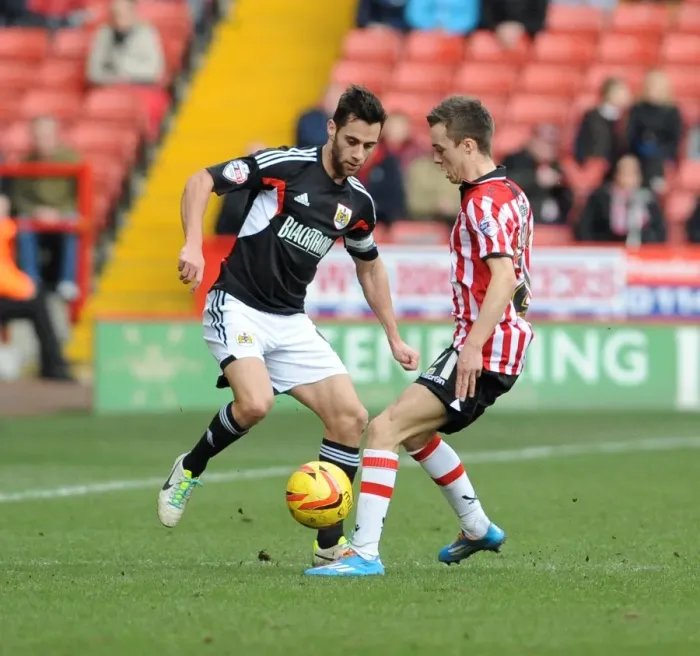 Framed Print : Bristol City's Sam Baldock Closes In on Sheffield United's Stefan Scougall in Intense League One Clash Framed Print : Bristol City's Sam Baldock Closes In on Sheffield United's Stefan Scougall in Intense League One Clash
