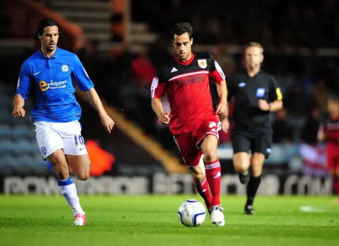 Framed Print : Bristol City's Sam Baldock Dashes Past George Boyd of Peterborough United in Championship Clash Framed Print : Bristol City's Sam Baldock Dashes Past George Boyd of Peterborough United in Championship Clash