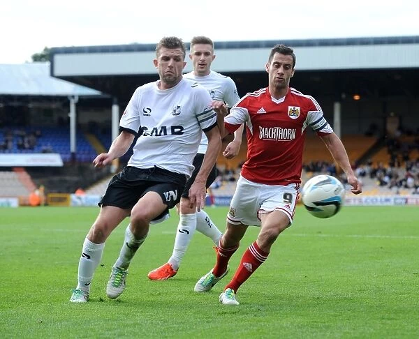 Bristol City's Sam Baldock Outmuscles Port Vale's Adam Yates for the Ball