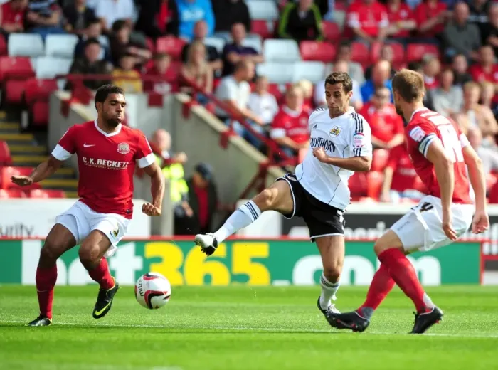Framed Print : Bristol City's Sam Baldock Tries to Squeeze Past Barnsley's Defenders Framed Print : Bristol City's Sam Baldock Tries to Squeeze Past Barnsley's Defenders