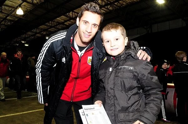 Bristol City's Sam Baldock and Young Fan Share a Moment at Ashton Gate during Bristol City vs Leicester City (January 12, 2013)
