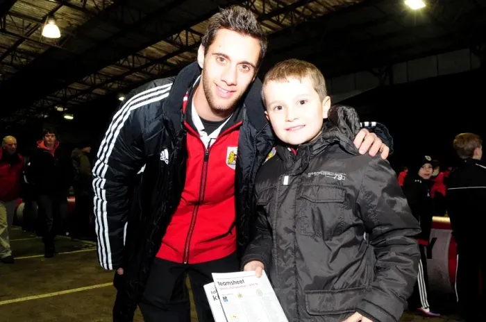 Framed Print : Bristol City's Sam Baldock and Young Fan Share a Moment at Ashton Gate during Bristol City vs Leicester City (January 12, 2013)
