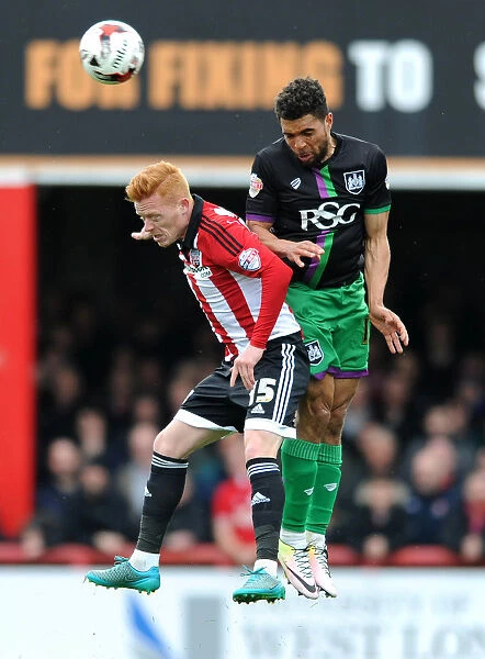 Bristol City's Scott Golbourne and Brentford's Ryan Woods Battle for Aerial Supremacy in Championship Clash